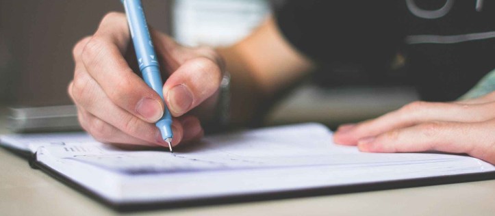 Person writing in a notebook