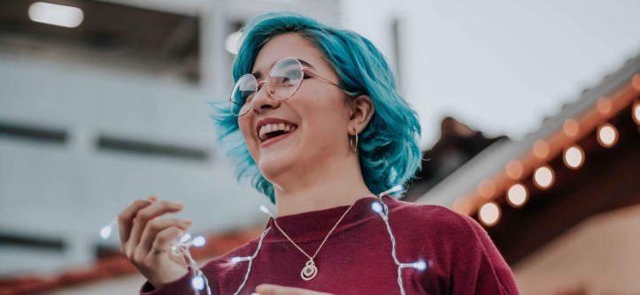 photo of woman holding string lights self care happy the patchwork fox