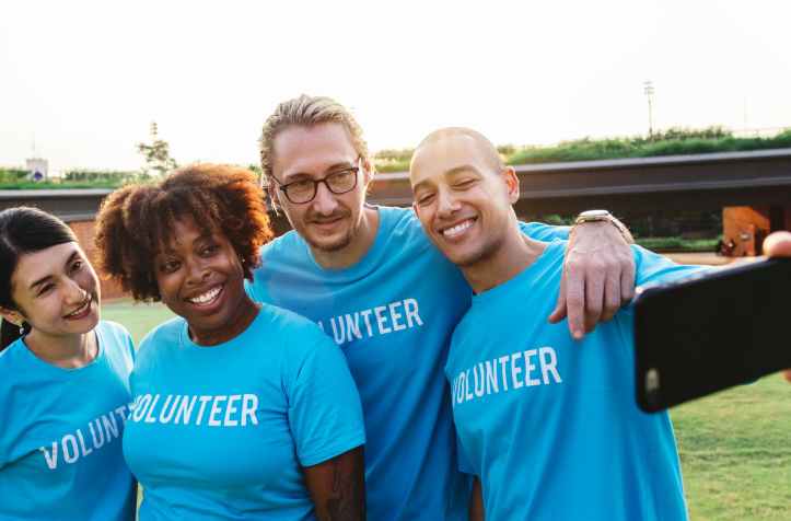 two men and two women taking a selfie