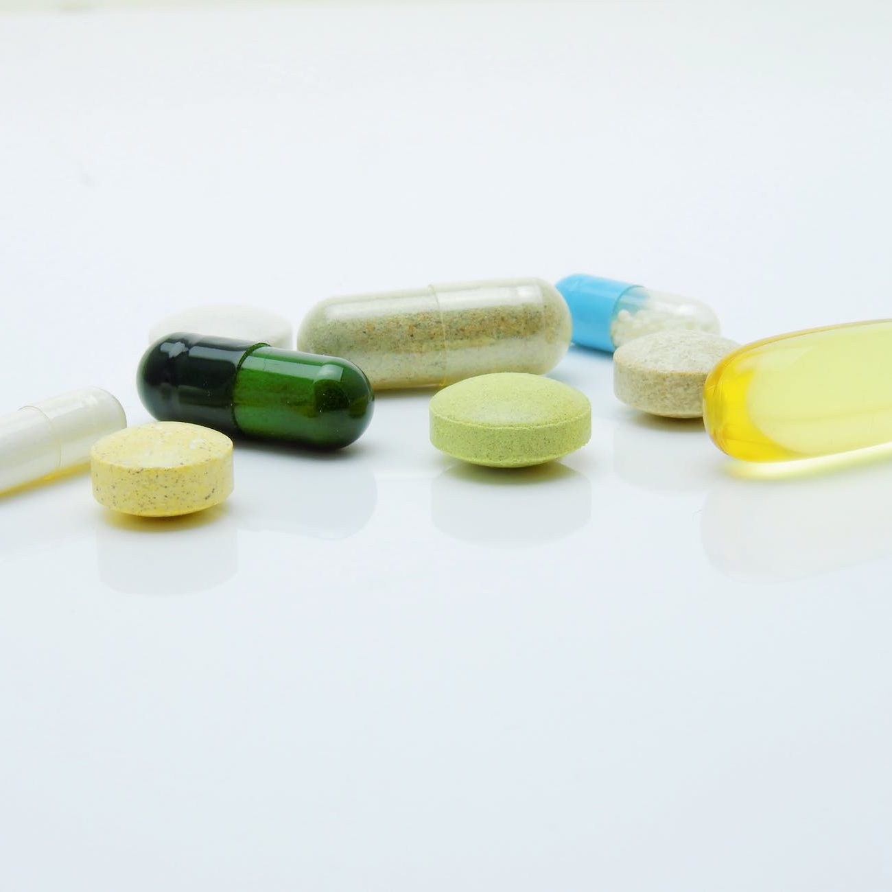 A close up stock photo of various pills. (wallflowerhaze.com)
