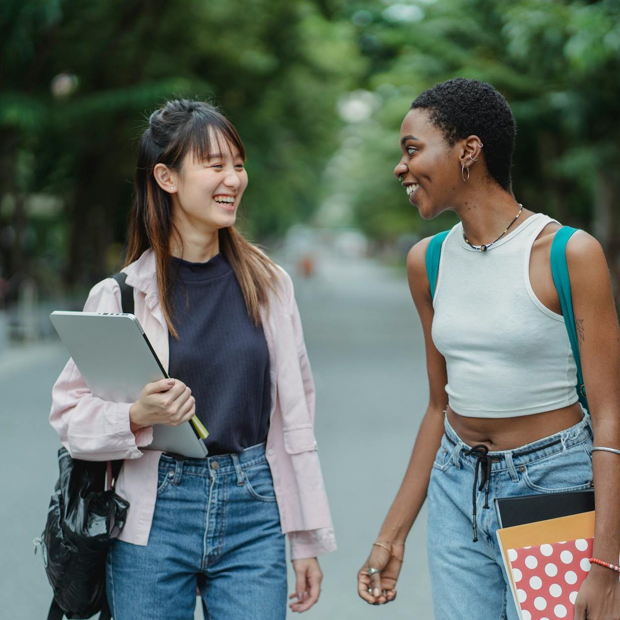 Two college students smiling at each other. (wallflowerhaze.com)