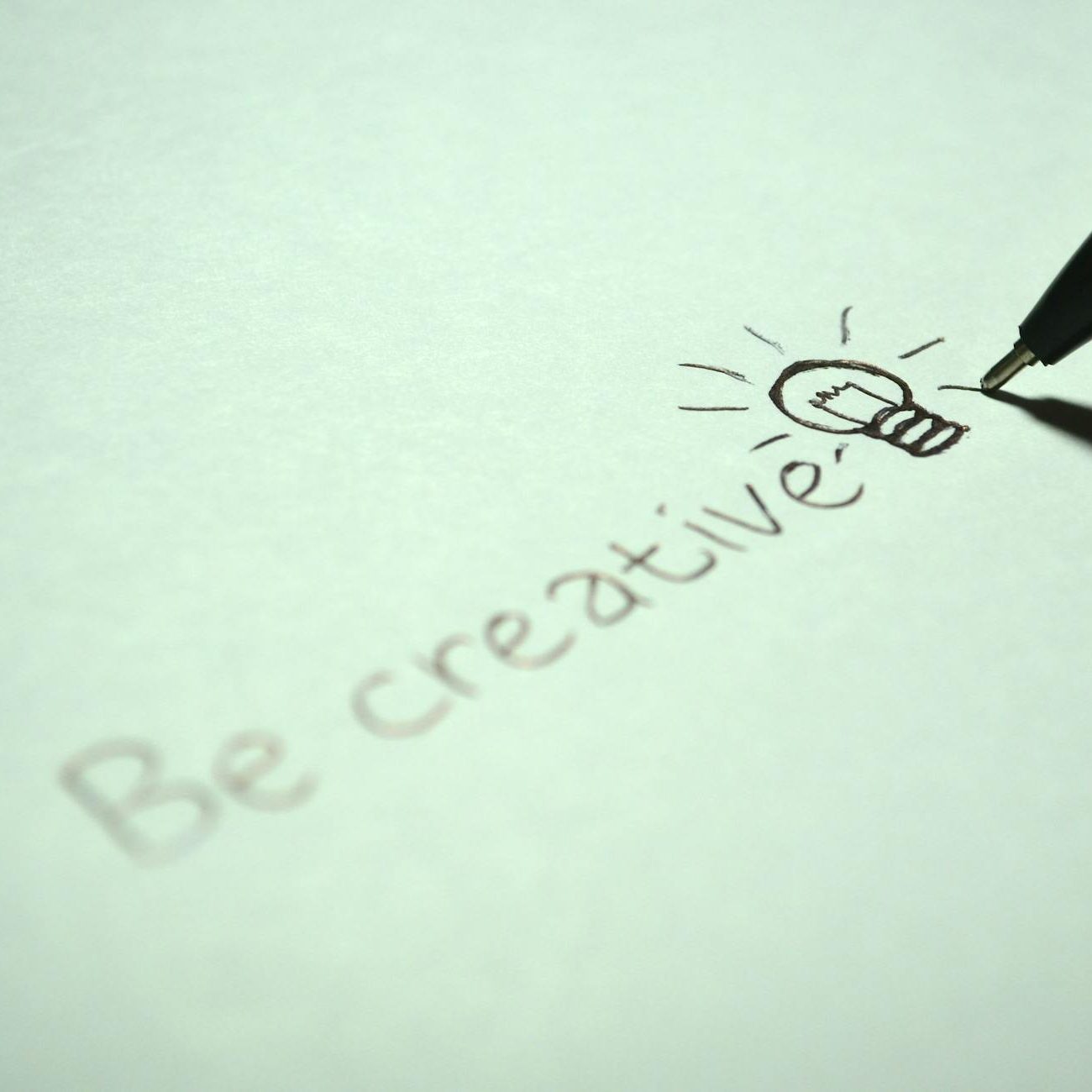 Handwritten wording "Be creative" with a lightbulb. The pen is still visible, drawing light coming from the lightbulb. (wallflowerhaze.com)